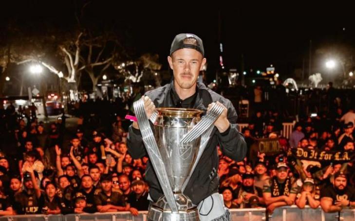 Anton Matinlauri raising the Major League Soccer cup