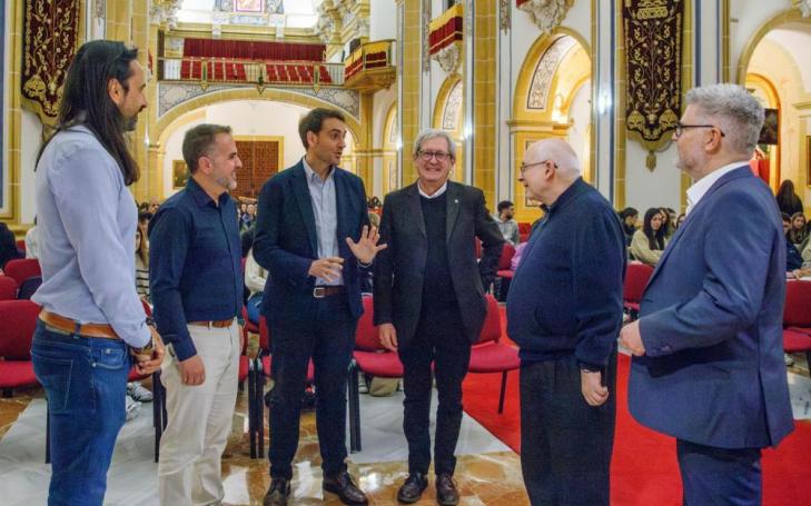 Monsignor Bruno Duffé and Antonio Alcaraz, director of the conference, talking to some of the participants
