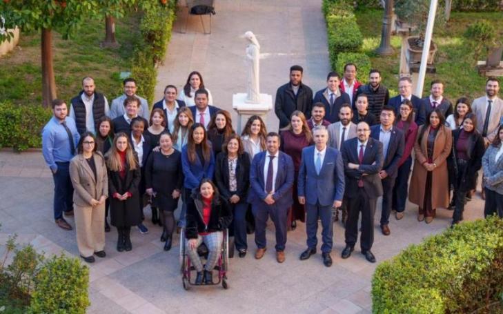 Participants in the UCAM international delegates' meeting with María Dolores García, UCAM president.