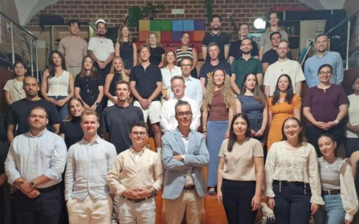 Group photo of the students and university representatives in the UCAM TV Studio.