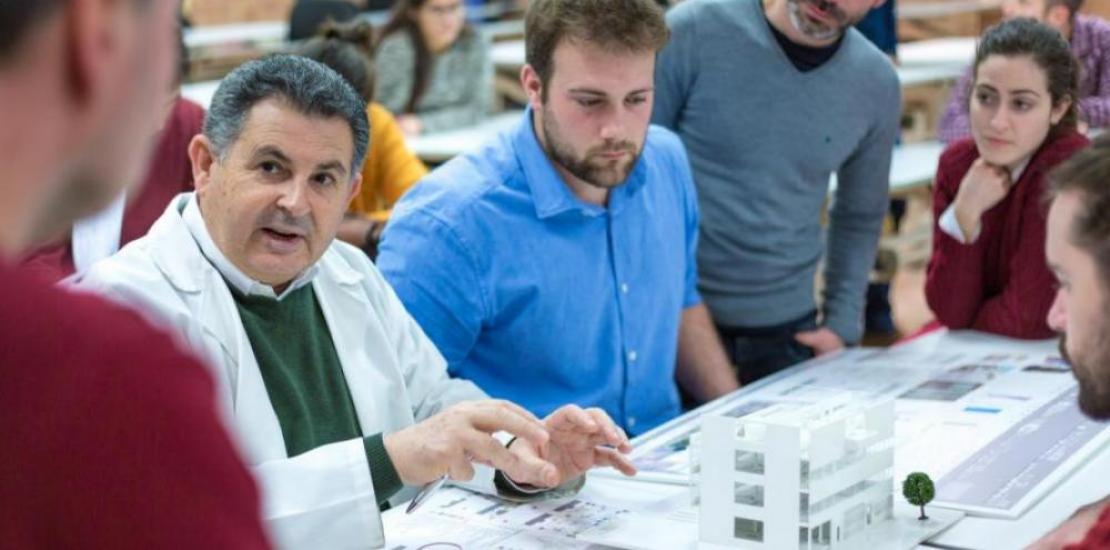 Juan Roldán, title Director, with a group of students