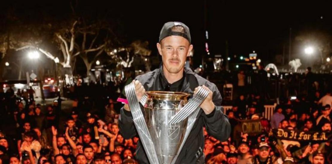 Anton Matinlauri raising the Major League Soccer cup