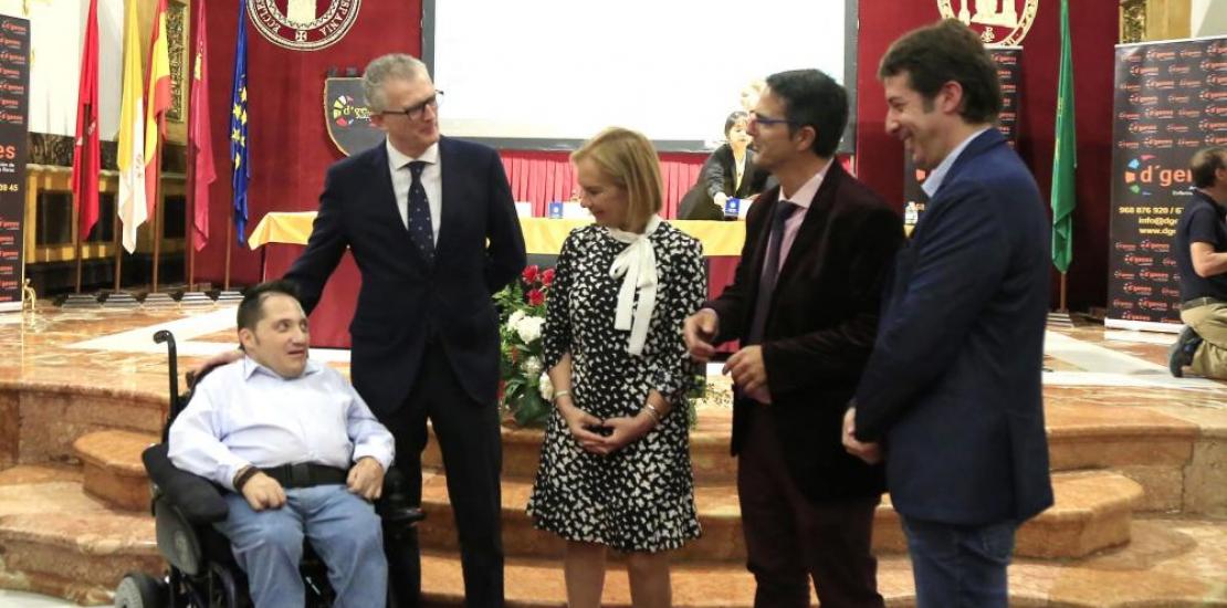 Juan José Pedreño, Minister of Health, Josefina García, Rector of UCAM, and Juan Carrión, President of D'Genes, talk to Juan Antonio Carrasco and Óscar González, who live with a rare disease