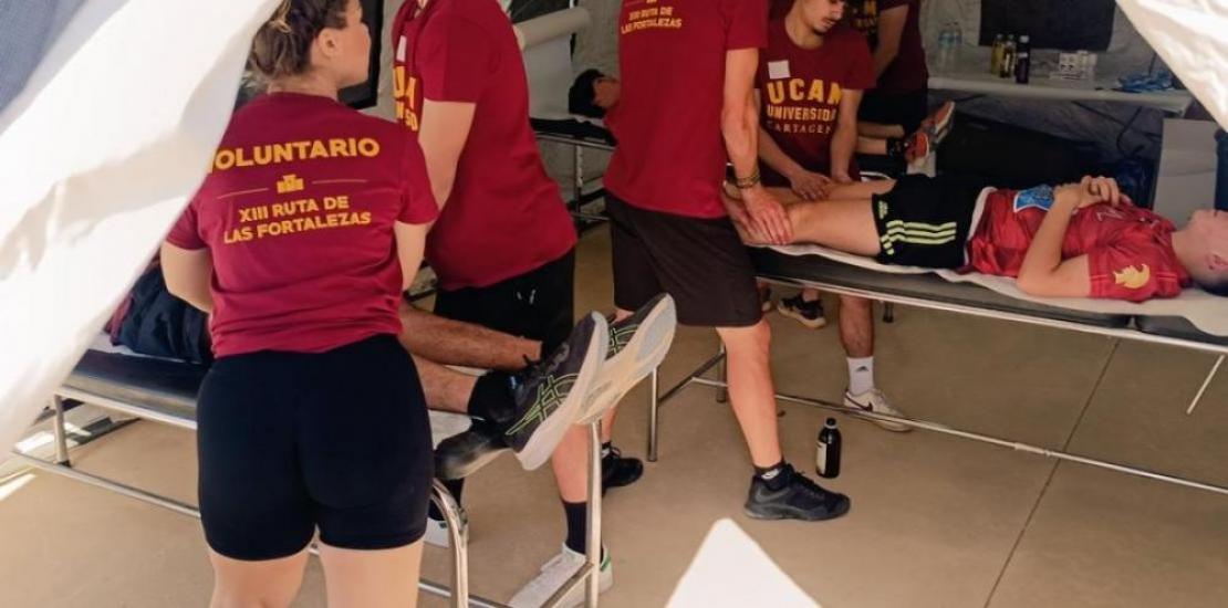 UCAM Students assisting participants 