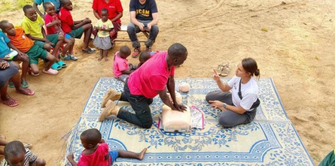 Members of the humanitarian expedition team teach CPR techniques to inhabitants of the Kikaya area, Uganda.