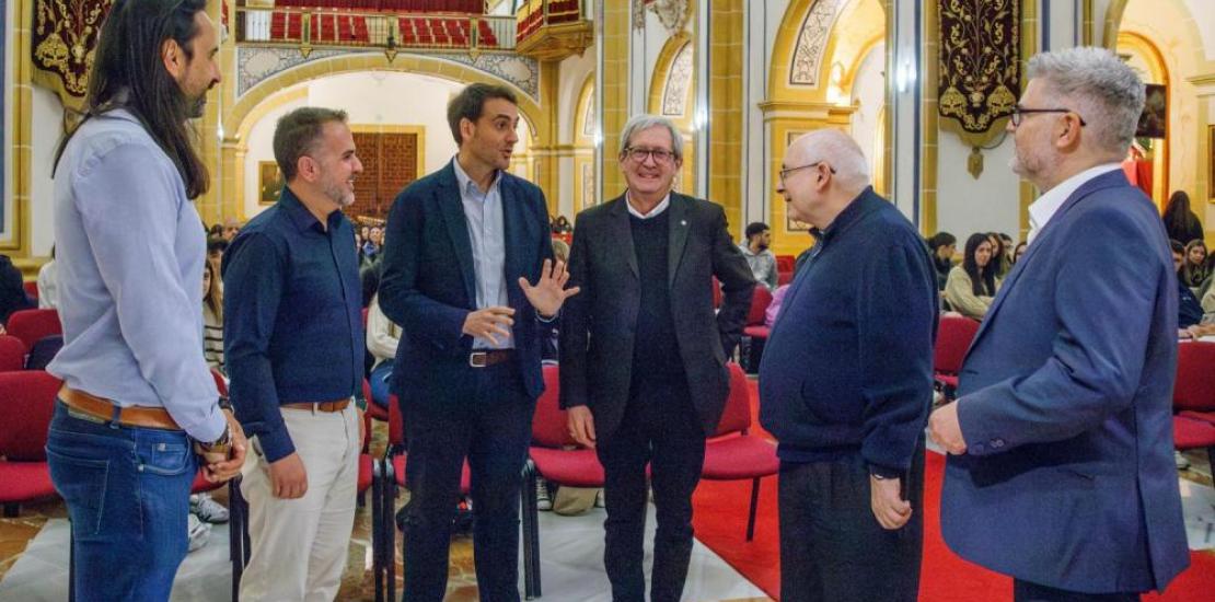 Monsignor Bruno Duffé and Antonio Alcaraz, director of the conference, talking to some of the participants
