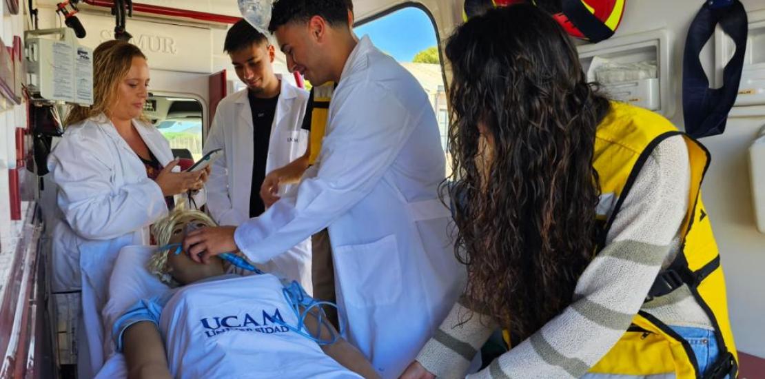 A group of nursing students during a practical class in the university&#039;s teaching ambulance.