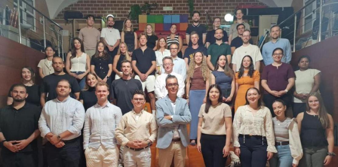 Group photo of the students and university representatives in the UCAM TV Studio.