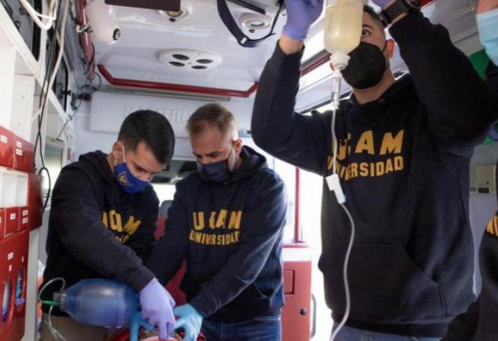 Manuel Pardo (2nd left) and Yasell Parra (3rd left) together with two other UCAM professors preparing the equipment they will use in Uganda.