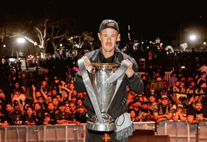 Anton Matinlauri raising the Major League Soccer cup 