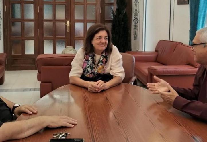 María Dolores García, meeting with Armando Rangel (right), and Antonio Alcaraz