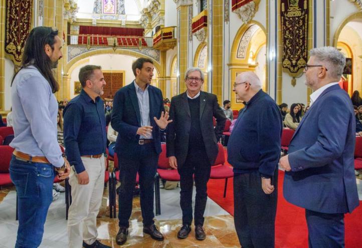 Monsignor Bruno Duffé and Antonio Alcaraz, director of the conference, talking to some of the participants