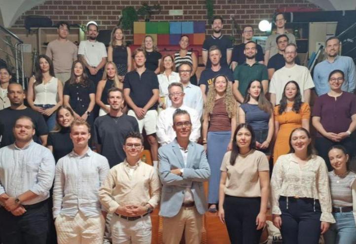 Group photo of the students and university representatives in the UCAM TV Studio.